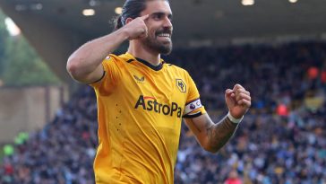 Wolverhampton Wanderers' Portuguese midfielder Ruben Neves celebrates after scoring the opening goal from the penalty spot during the English Premier League football match between Wolverhampton Wanderers and Nottingham Forest at the Molineux stadium in Wolverhampton, central England on October 15, 2022.
