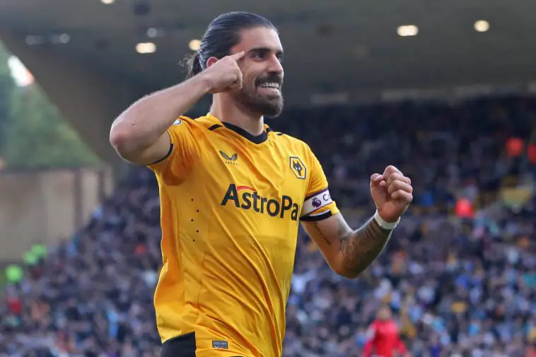 Wolverhampton Wanderers' Portuguese midfielder Ruben Neves celebrates after scoring the opening goal from the penalty spot during the English Premier League football match between Wolverhampton Wanderers and Nottingham Forest at the Molineux stadium in Wolverhampton, central England on October 15, 2022.