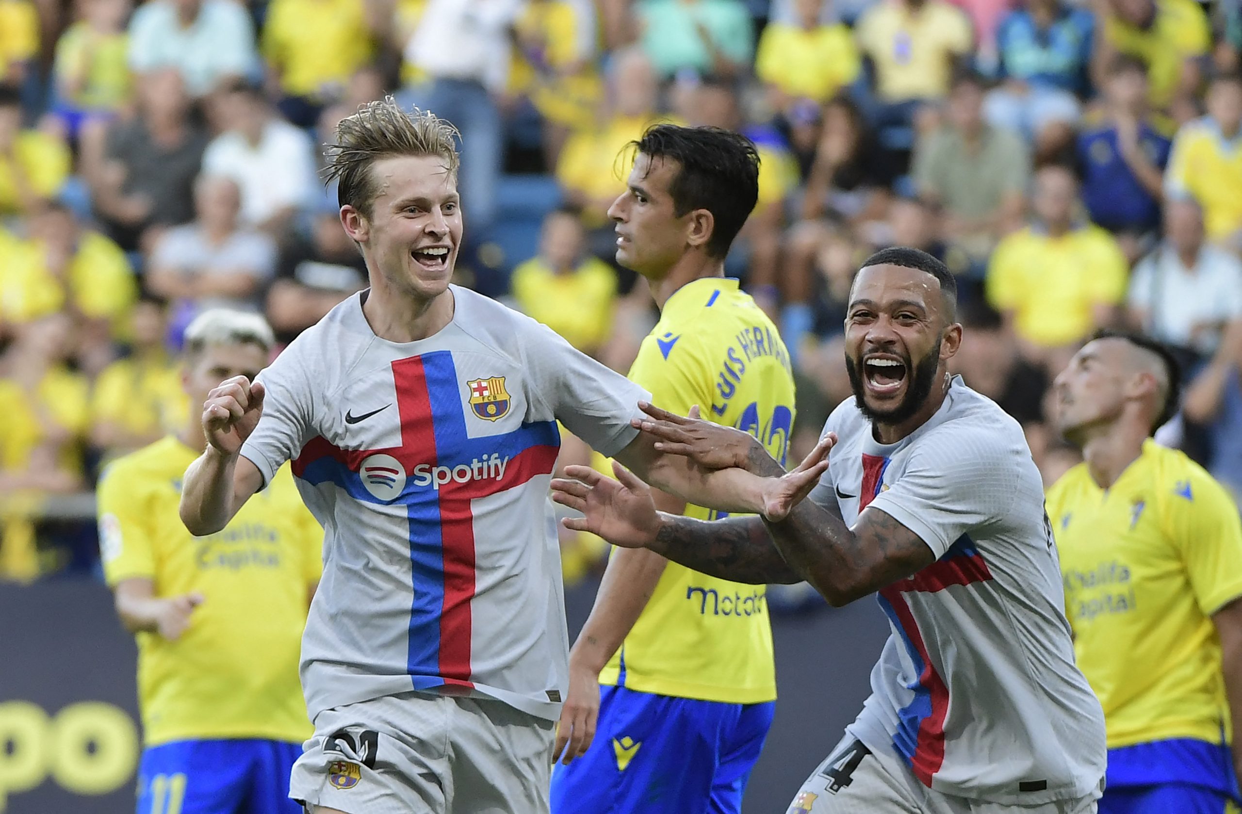 Barcelona's Frenkie De Jong Memphis Depay after scoring his team's first goal during the Spanish league football match between Cadiz CF and FC Barcelona at the Nuevo Mirandilla stadium in Cadiz, on September 10, 2022.