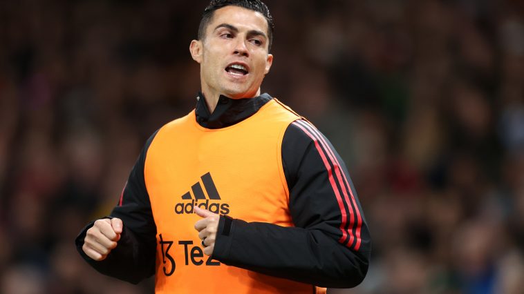 Cristiano Ronaldo of Manchester United warms up on the sidelines during the Premier League match between Manchester United and Tottenham Hotspur at Old Trafford on October 19, 2022 in Manchester, England.