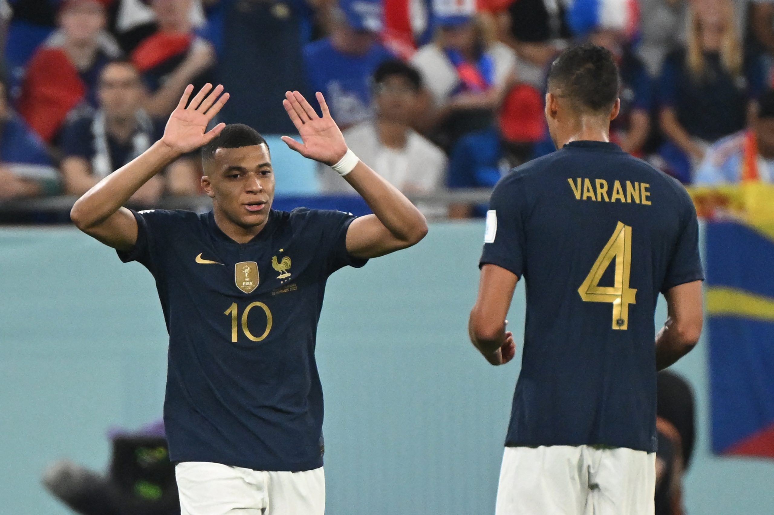 Kylian Mbappe celebrates with France's Raphael Varane. (Photo by NATALIA KOLESNIKOVA/AFP via Getty Images)