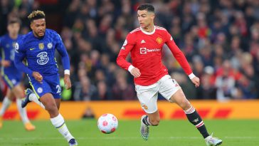 Cristiano Ronaldo of Manchester United runs with ball as Reece James of Chelsea gives chase. (Photo by Alex Livesey/Getty Images)