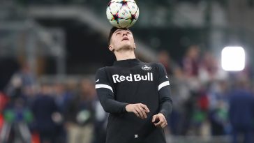 Benjamin Sesko of FC Salzburg warms up prior to the UEFA Champions League group E match between AC Milan and FC Salzburg at Giuseppe Meazza Stadium on November 02, 2022 in Milan, Italy