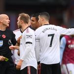 Referee Anthony Taylor is confronted by Christian Eriksen and Cristiano Ronaldo of Manchester United during the Premier League match between Aston Villa and Manchester United at Villa Park on November 06, 2022 in Birmingham, England