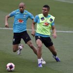 Fabinho (L) and Casemiro in action during a training session of the Brazilian national football team at the squad's Granja Comary training complex on March 28, 2022 in Teresopolis, Brazil. Brazil faces Bolivia on March 29 as part of the South American FIFA World Cup Qualifiers for Qatar 2022 at the Hernando Siles Olympic Stadium in La Paz, Bolivia