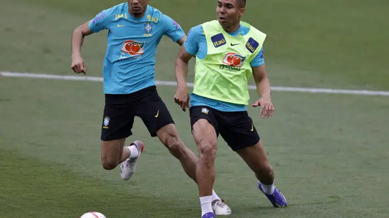 Fabinho (L) and Casemiro in action during a training session of the Brazilian national football team at the squad's Granja Comary training complex on March 28, 2022 in Teresopolis, Brazil. Brazil faces Bolivia on March 29 as part of the South American FIFA World Cup Qualifiers for Qatar 2022 at the Hernando Siles Olympic Stadium in La Paz, Bolivia