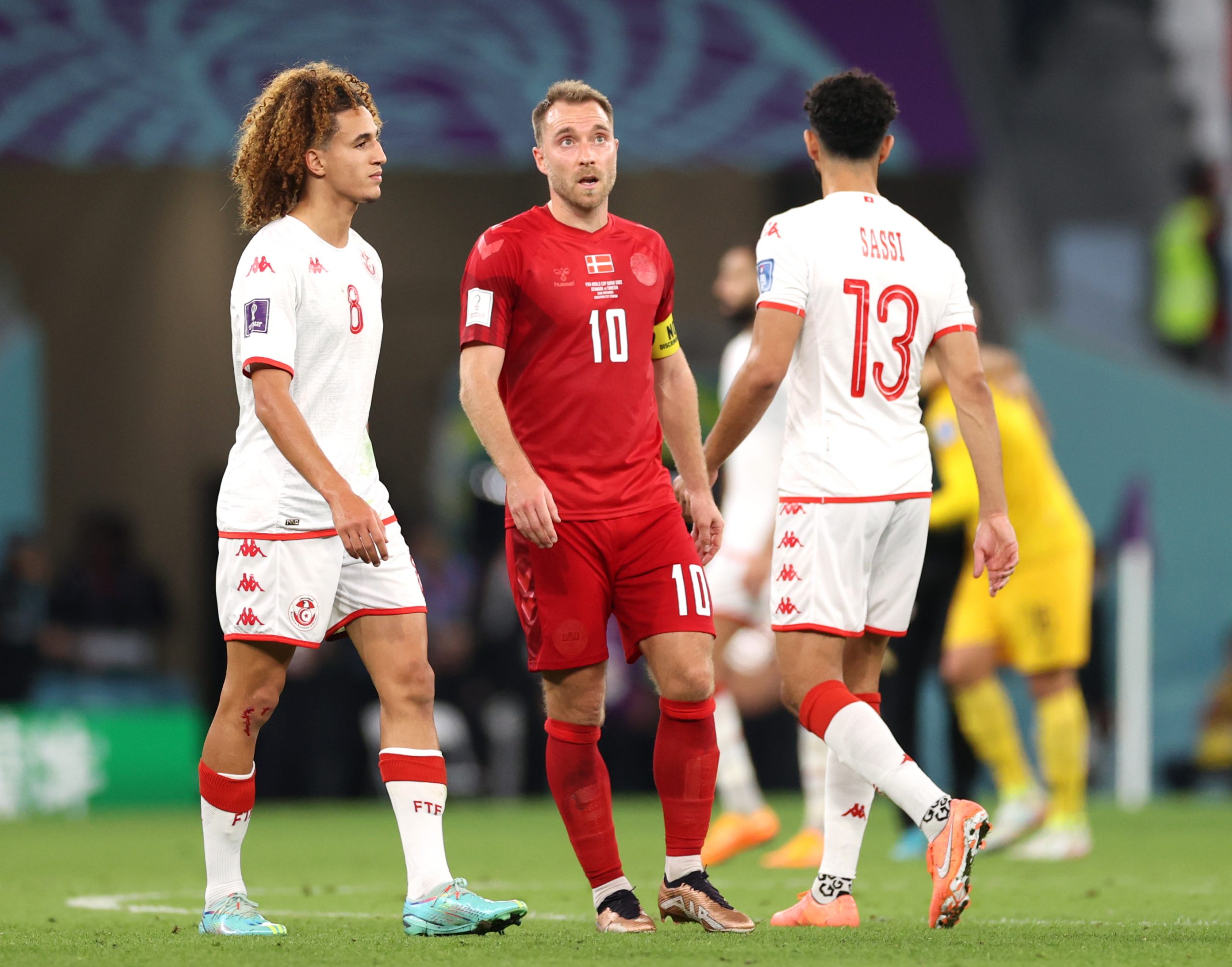 Christian Eriksen of Denmark speaks with Hannibal Mejbri of Tunisia after the 0-0 draw during the FIFA World Cup Qatar 2022 Group D match between Denmark and Tunisia at Education City Stadium on November 22, 2022 in Al Rayyan, Qatar.