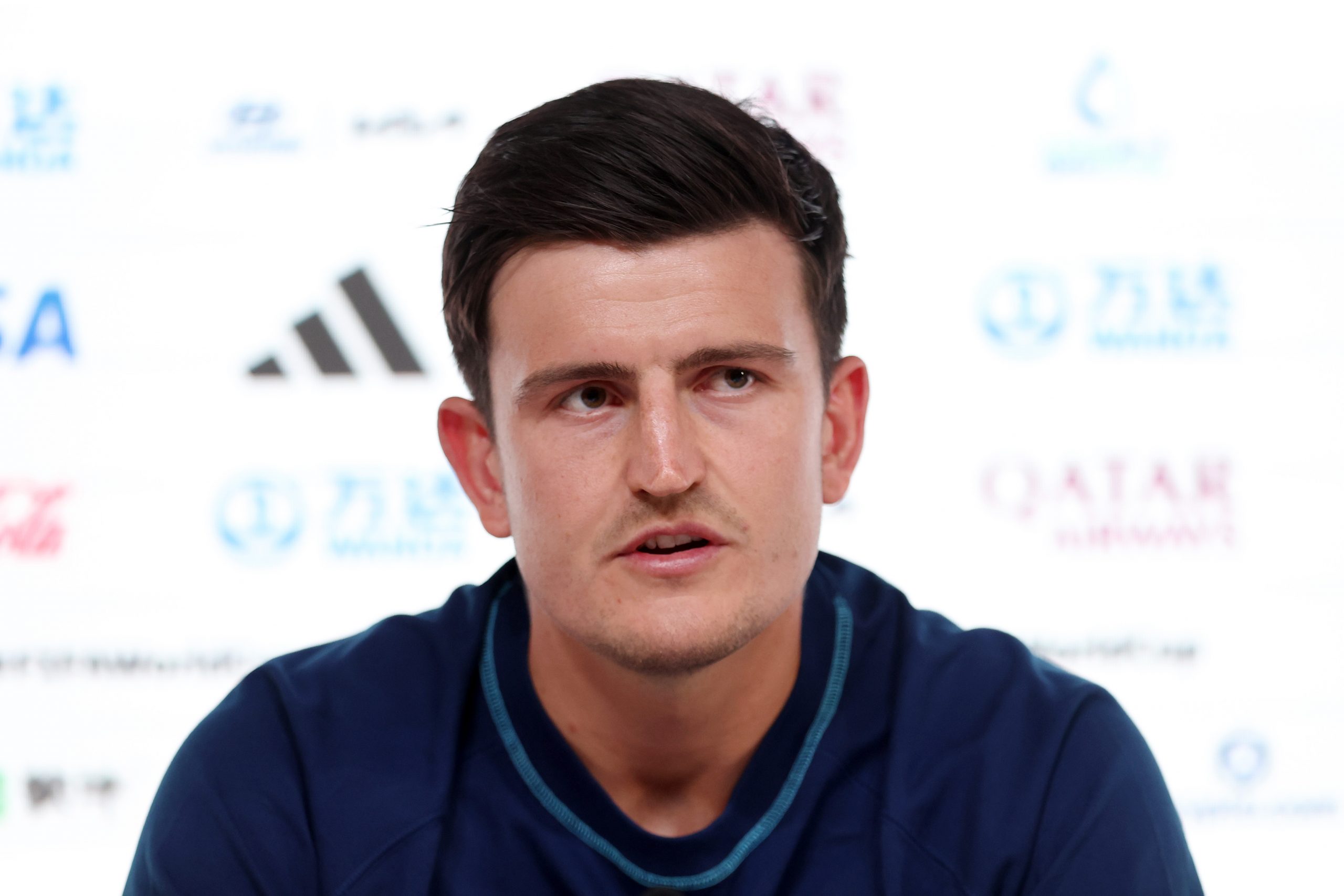 Harry Maguire of England speaks during the England Press Conference at the Main Media Center on November 24, 2022 in Doha, Qatar