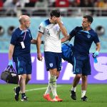 Harry Maguire of England walks off the pitch with medical staffs after being substituted as he picks up an injury during the FIFA World Cup Qatar 2022 Group B match between England and IR Iran at Khalifa International Stadium on November 21, 2022 in Doha, Qatar.