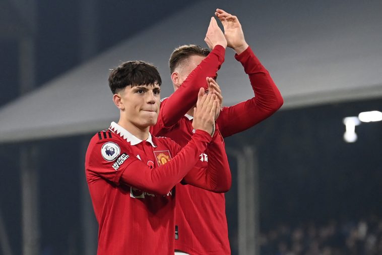 Manchester United's Argentinian midfielder Alejandro Garnacho (L) and Manchester United's Scottish midfielder Scott McTominay (R) applaud fans on the pitch after the English Premier League football match between Fulham and Manchester United at Craven Cottage in London on November 13, 2022.