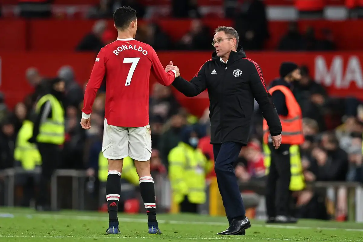 Manchester United's Portuguese striker Cristiano Ronaldo (L) and Manchester United German Interim head coach Ralf Rangnick (R) shake hands after the final whistle of the English Premier League football match between Manchester United and Crystal Palace at Old Trafford in Manchester, north west England, on December 5, 2021.
