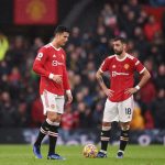 Manchester United's Portuguese striker Cristiano Ronaldo (L) and Manchester United's Portuguese midfielder Bruno Fernandes reacts during the English Premier League football match between Manchester United and Manchester City at Old Trafford in Manchester, north west England, on November 6, 2021.