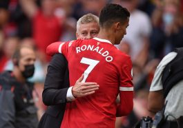 Manchester United's Norwegian manager Ole Gunnar Solskjaer (L) embraces Manchester United's Portuguese striker Cristiano Ronaldo (R) after the English Premier League football match between Manchester United and Newcastle at Old Trafford in Manchester, north west England, on September 11, 2021