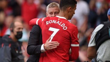 Manchester United's Norwegian manager Ole Gunnar Solskjaer (L) embraces Manchester United's Portuguese striker Cristiano Ronaldo (R) after the English Premier League football match between Manchester United and Newcastle at Old Trafford in Manchester, north west England, on September 11, 2021