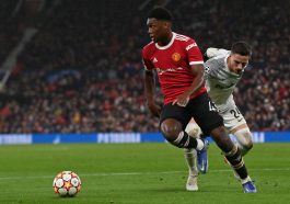 Manchester United's English defender Teden Mengi (L) controls the ball during the UEFA Champions League Group F football match between Manchester United and Young Boys at Old Trafford stadium in Manchester, north west England on December 8, 2021.