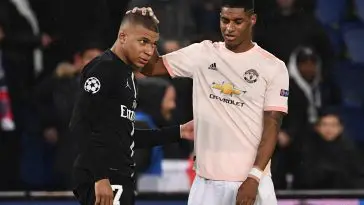 Manchester United's English forward Marcus Rashford (R) cheers up Paris Saint-Germain's French forward Kylian Mbappe at the end of the UEFA Champions League round of 16 second-leg football match between Paris Saint-Germain (PSG) and Manchester United at the Parc des Princes stadium in Paris on March 6, 2019.