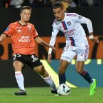 Lorient's French midfielder Theo Le Bris (L) vies with Lyon's French defender Malo Gusto (R) during the French L1 football match between Lorient and Lyon (OL) at the Stade du Moustoir in Lorient, on September 7, 2022.
