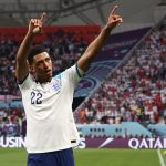 England's midfielder #22 Jude Bellingham celebrates after scoring his team's first goal during the Qatar 2022 World Cup Group B football match between England and Iran at the Khalifa International Stadium in Doha on November 21, 2022.