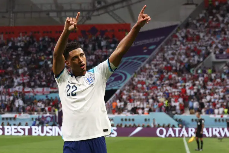 England's midfielder #22 Jude Bellingham celebrates after scoring his team's first goal during the Qatar 2022 World Cup Group B football match between England and Iran at the Khalifa International Stadium in Doha on November 21, 2022.