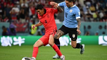 Uruguay's forward #11 Darwin Nunez fights for the ball with South Korea's defender #04 Kim Min-jae during the Qatar 2022 World Cup Group H football match between Uruguay and South Korea at the Education City Stadium in Al-Rayyan, west of Doha on November 24, 2022.