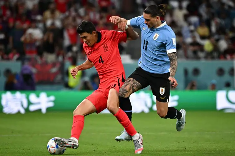 Uruguay's forward #11 Darwin Nunez fights for the ball with South Korea's defender #04 Kim Min-jae during the Qatar 2022 World Cup Group H football match between Uruguay and South Korea at the Education City Stadium in Al-Rayyan, west of Doha on November 24, 2022.