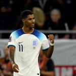 England's forward #11 Marcus Rashford celebrates after scoring his team's third goal during the Qatar 2022 World Cup Group B football match between Wales and England at the Ahmad Bin Ali Stadium in Al-Rayyan, west of Doha on November 29, 2022.