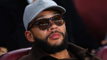 Memphis Depay of FC Barcelona looks on from the stands during the UEFA Champions League group C match between FC Barcelona and FC Bayern München at Spotify Camp Nou on October 26, 2022 in Barcelona, Spain