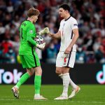 Harry Maguire of England interacts with Jordan Pickford of England during the penalty shoot out during the UEFA Euro 2020 Championship Final between Italy and England at Wembley Stadium on July 11, 2021 in London, England.