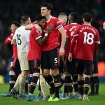 Harry Maguire of Manchester United celebrates with teammate Fred (L) after victory in the Premier League match between Leeds United and Manchester United at Elland Road on February 20, 2022 in Leeds, England