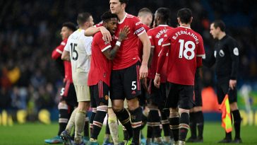 Harry Maguire of Manchester United celebrates with teammate Fred (L) after victory in the Premier League match between Leeds United and Manchester United at Elland Road on February 20, 2022 in Leeds, England