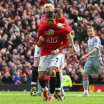 Cristiano Ronaldo of Manchester United celebrates with team mate Wayne Rooney after scoring the opening goal from the penalty spot during the Barclays Premier League match between Manchester United and Liverpool at Old Trafford on March 14, 2009 in Manchester, England.