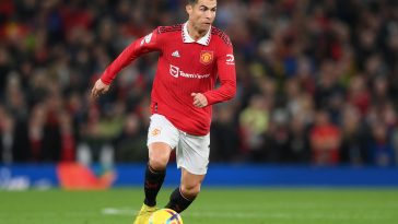 Cristiano Ronaldo of Manchester United runs with the ball during the Premier League match between Manchester United and West Ham United at Old Trafford on October 30, 2022 in Manchester, England
