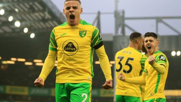 Max Aarons of Norwich City celebrates after their side's first goal, an own goal scored by Michael Keane of Everton during the Premier League match between Norwich City and Everton at Carrow Road on January 15, 2022 in Norwich, England