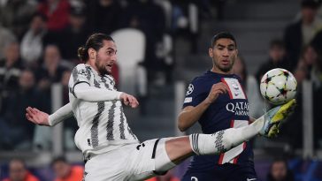 Juventus' French midfielder Adrien Rabiot (L) fights for the ball with Paris Saint-Germain's Moroccan defender Achraf Hakimi during the UEFA Champions League 1st round day 6 group H football match between Juventus Turin and Paris Saint-Germain (PSG) at the Juventus stadium in Turin on November 2, 2022