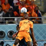 Netherlands' defender Denzel Dumfries heads the ball during the Qatar 2022 World Cup Group A football match between the Netherlands and Ecuador at the Khalifa International Stadium in Doha on November 25, 2022