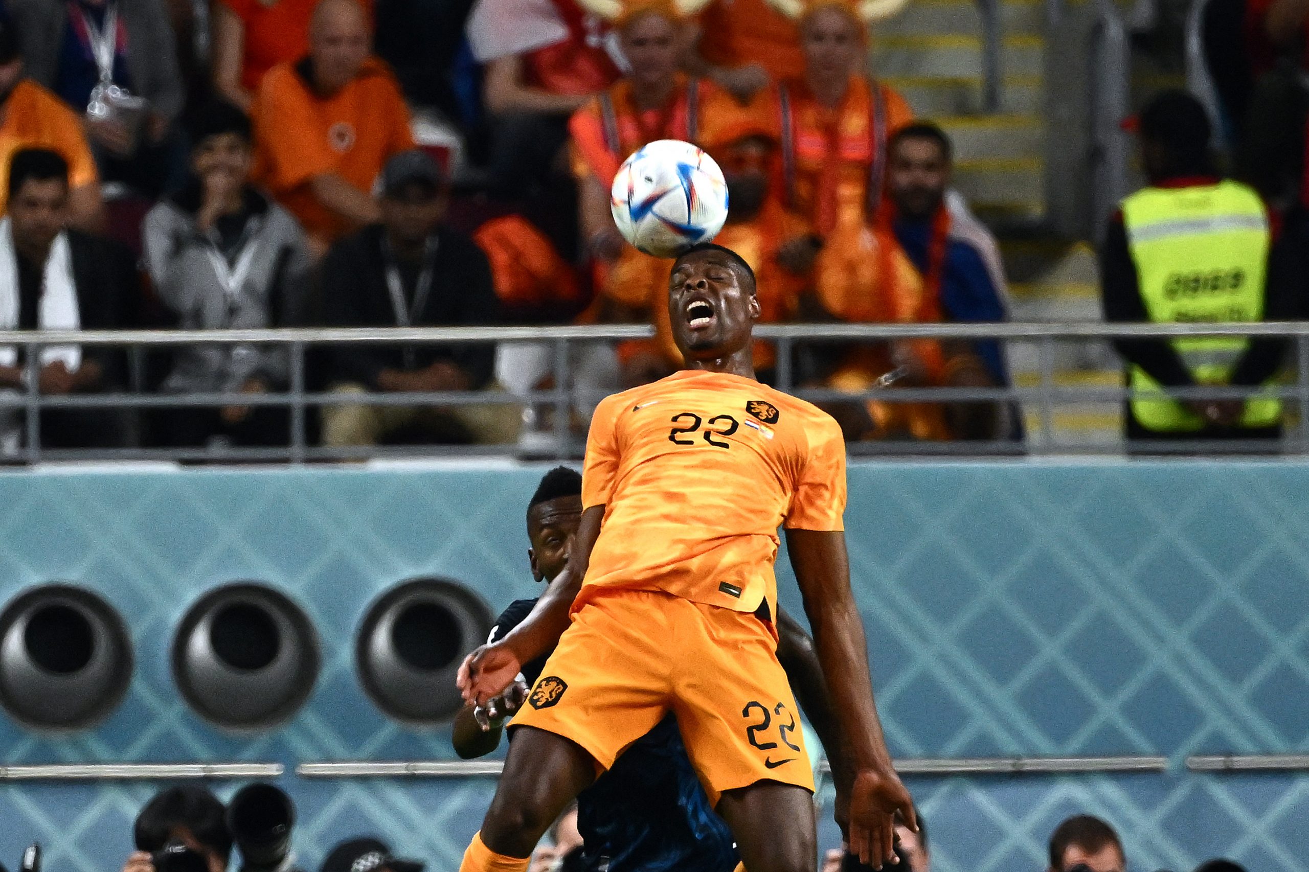 Netherlands' defender Denzel Dumfries heads the ball during the Qatar 2022 World Cup Group A football match between the Netherlands and Ecuador at the Khalifa International Stadium in Doha on November 25, 2022