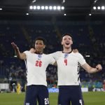 Jude Bellingham and Declan Rice of England celebrate after victory in the UEFA Euro 2020 Championship Quarter-final match between Ukraine and England at Olimpico Stadium on July 03, 2021 in Rome, Italy.