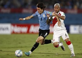 Facundo Pellistri of Uruguay fights for the ball with Miguel Trauco of Peru during a match between Uruguay and Peru as part of FIFA World Cup Qatar 2022 Qualifiers at Centenario Stadium on March 24, 2022 in Montevideo, Uruguay