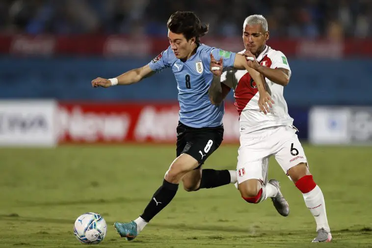 Facundo Pellistri of Uruguay fights for the ball with Miguel Trauco of Peru during a match between Uruguay and Peru as part of FIFA World Cup Qatar 2022 Qualifiers at Centenario Stadium on March 24, 2022 in Montevideo, Uruguay