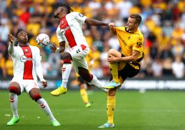 Sasa Kalajdzic of Wolverhampton Wanderers is challenged by Armel Bella-Kotchap and Mohammed Salisu of Southampton.