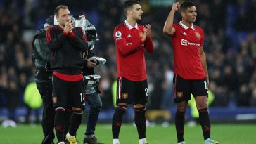 Christian Eriksen, Diogo Dalot and Casemiro of Manchester United acknowledge the fans.