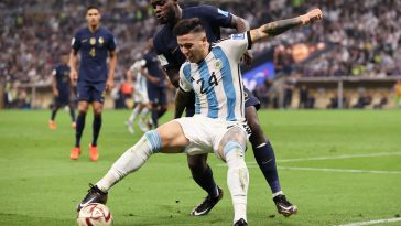 Enzo Fernandez of Argentina holds off a challenge from Dayot Upamecano of France during the FIFA World Cup Qatar 2022 Final match between Argentina and France at Lusail Stadium on December 18, 2022 in Lusail City, Qatar.