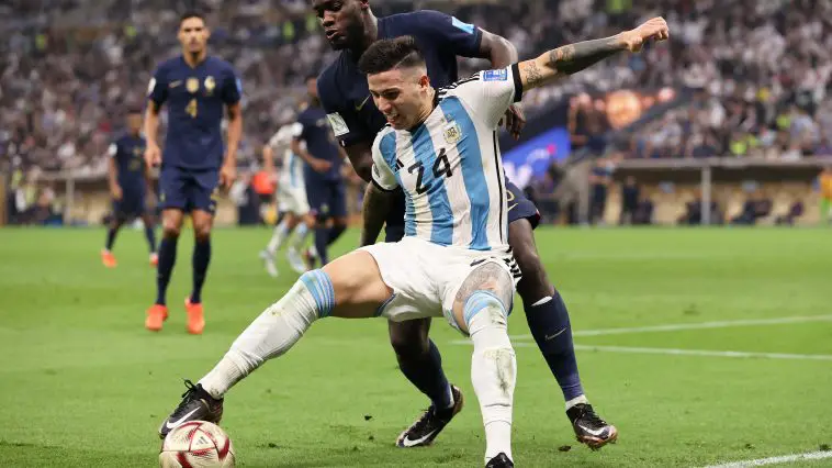 Enzo Fernandez of Argentina holds off a challenge from Dayot Upamecano of France during the FIFA World Cup Qatar 2022 Final match between Argentina and France at Lusail Stadium on December 18, 2022 in Lusail City, Qatar.