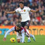 Douglas Luiz of Aston Villa is challenged by Anthony Martial of Manchester United during the Premier League match between Aston Villa and Manchester United at Villa Park on November 06, 2022 in Birmingham, England.