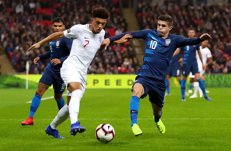 Jadon Sancho of England is challenged by Christian Pulisic of the United States during the International Friendly match between England and United States at Wembley Stadium on November 15, 2018 in London, United Kingdom.