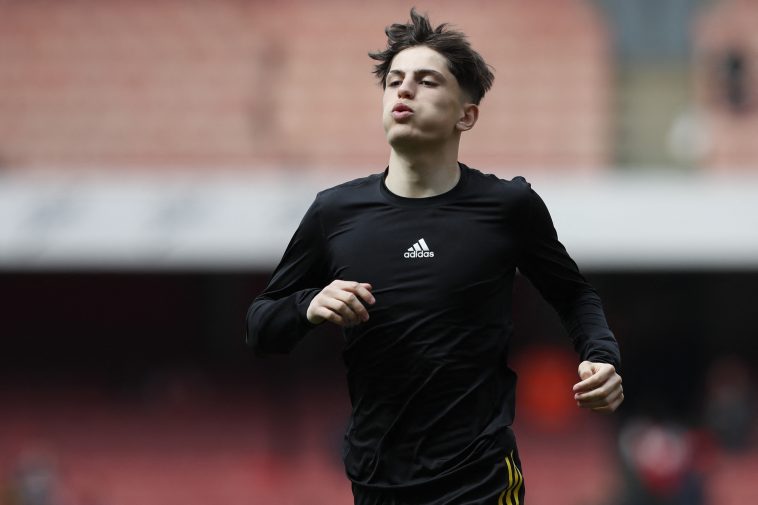 Manchester United's Argentinian midfielder Alejandro Garnacho warms down after the English Premier League football match between Arsenal and Manchester United at the Emirates Stadium in London on April 23, 2022.