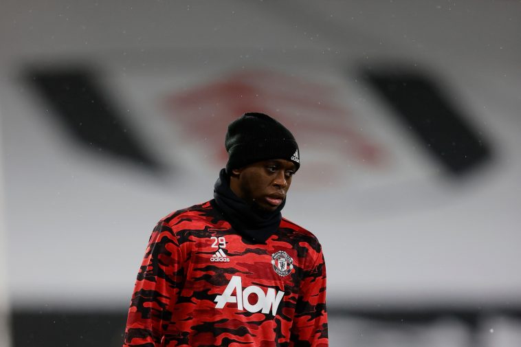 Manchester United's English defender Aaron Wan-Bissaka warms up for the English Premier League football match between Fulham and Manchester United at Craven Cottage in London on January 20, 2021.