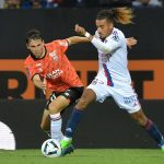 Lyon's French defender Malo Gusto (R) during the French L1 football match between Lorient and Lyon (OL) at the Stade du Moustoir in Lorient, on September 7, 2022.