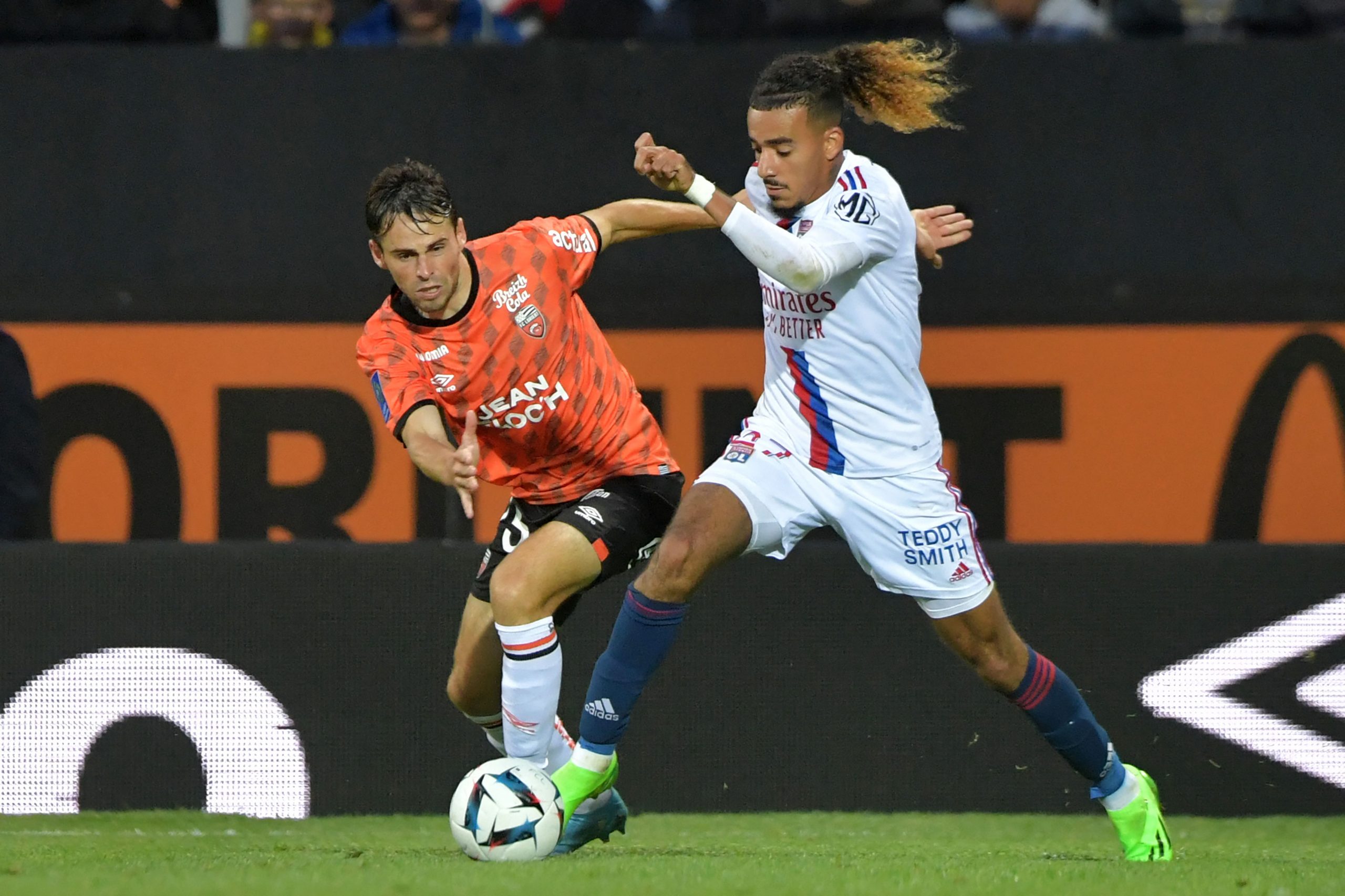 Lyon's French defender Malo Gusto (R) during the French L1 football match between Lorient and Lyon (OL) at the Stade du Moustoir in Lorient, on September 7, 2022.