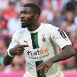Moenchengladbach's French forward Marcus Thuram celebrates scoring the opening goal during the German first division Bundesliga football match between Bayern Munich and Borussia Moenchengladbach in Munich, southern Germany on August 27, 2022